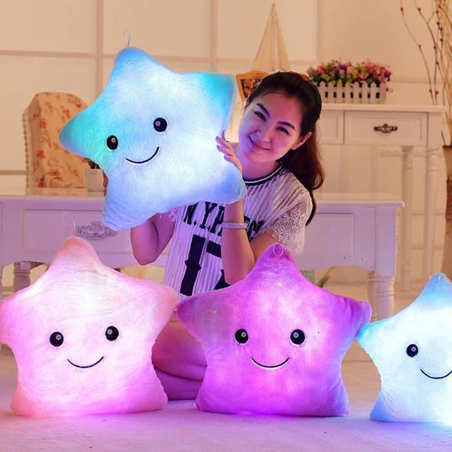 Cuscino peluche luminoso a stella rosa